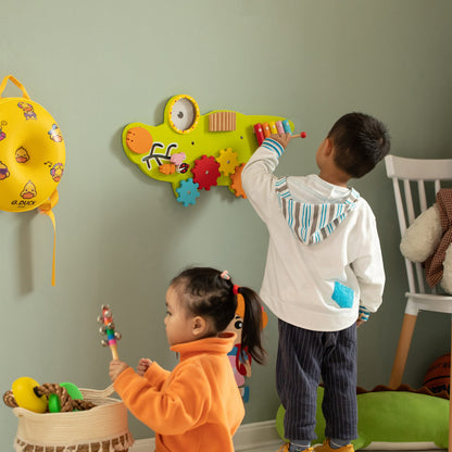 Toddler playing with alligator sensory wall mount learning center