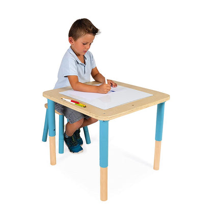 Children using Janod progressive activity table in a playroom