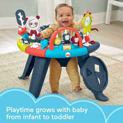 Infant using Fisher-Price activity center in seat mode
