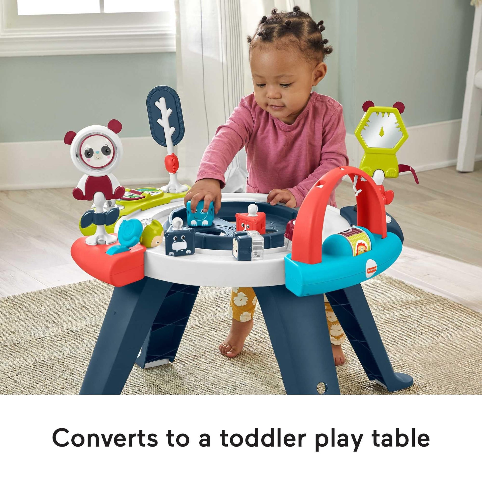 Toddler playing at the Fisher-Price 3-in-1 convertible table