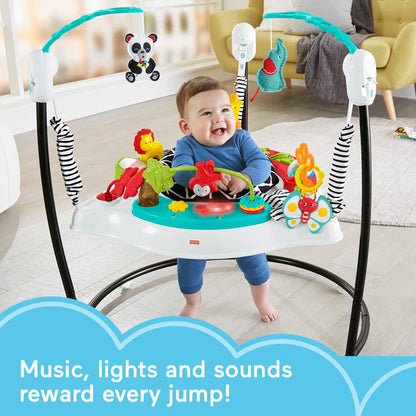 Baby sitting in Fisher-Price Pink Petals Jumperoo activity center