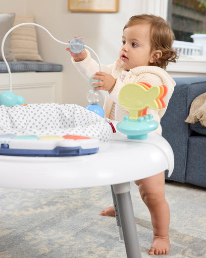 Skip Hop activity center showing various clip-on toy attachments