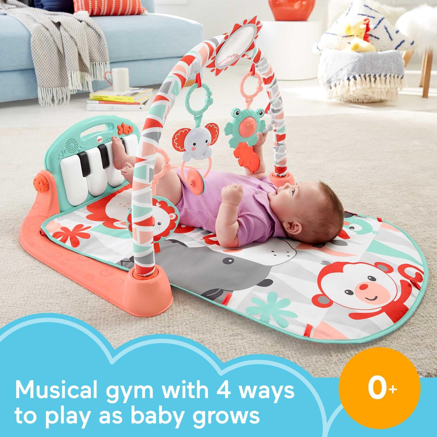 Newborn baby using Fisher-Price piano gym for tummy time