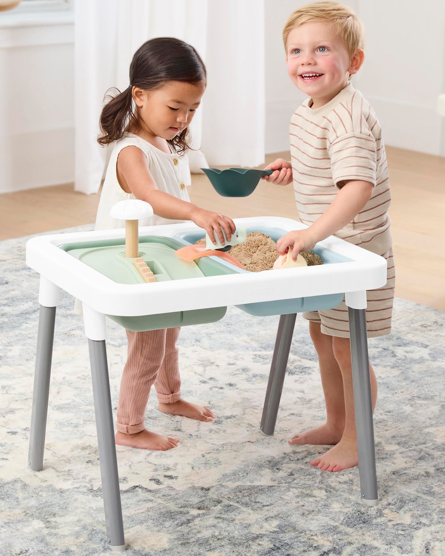Detailed view of nature-inspired sensory tools included with Skip Hop table