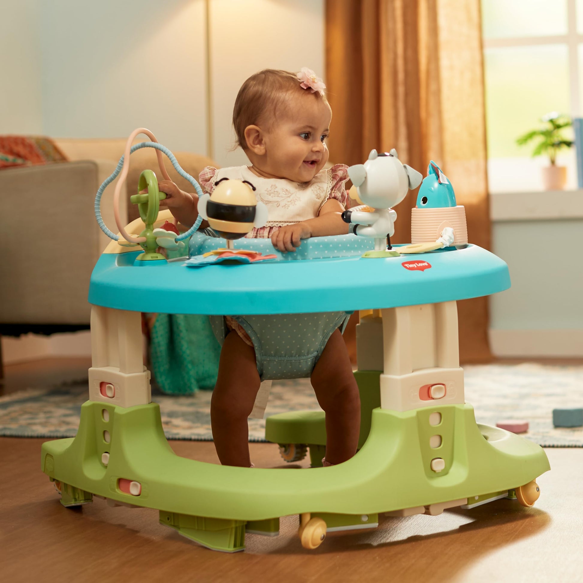 Educational toys attached to Tiny Love activity center tray