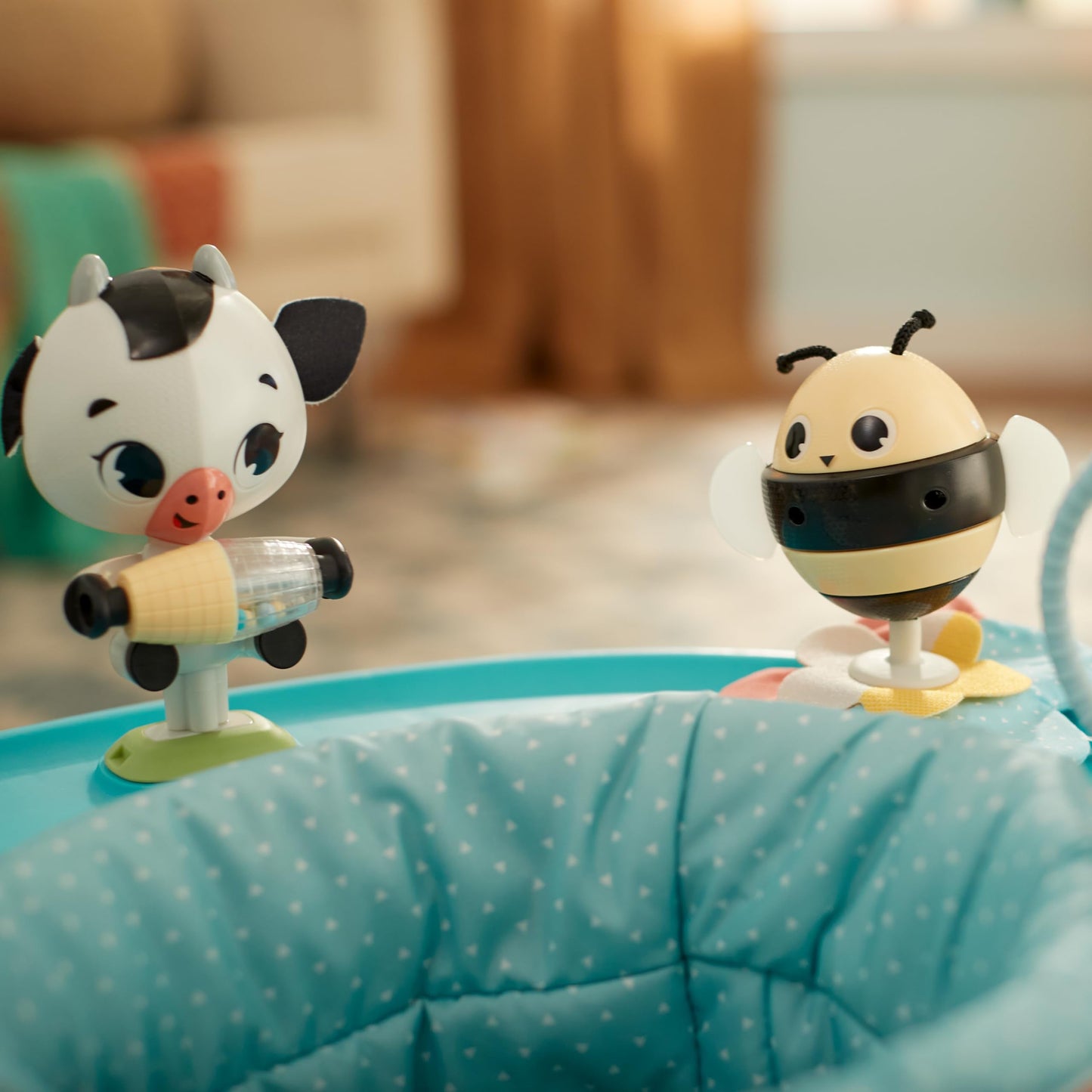 Child interacting with Tiny Love mobile activity center