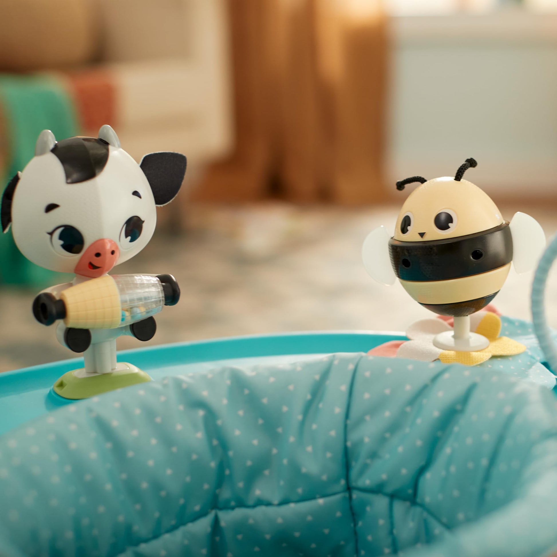 Child interacting with Tiny Love mobile activity center