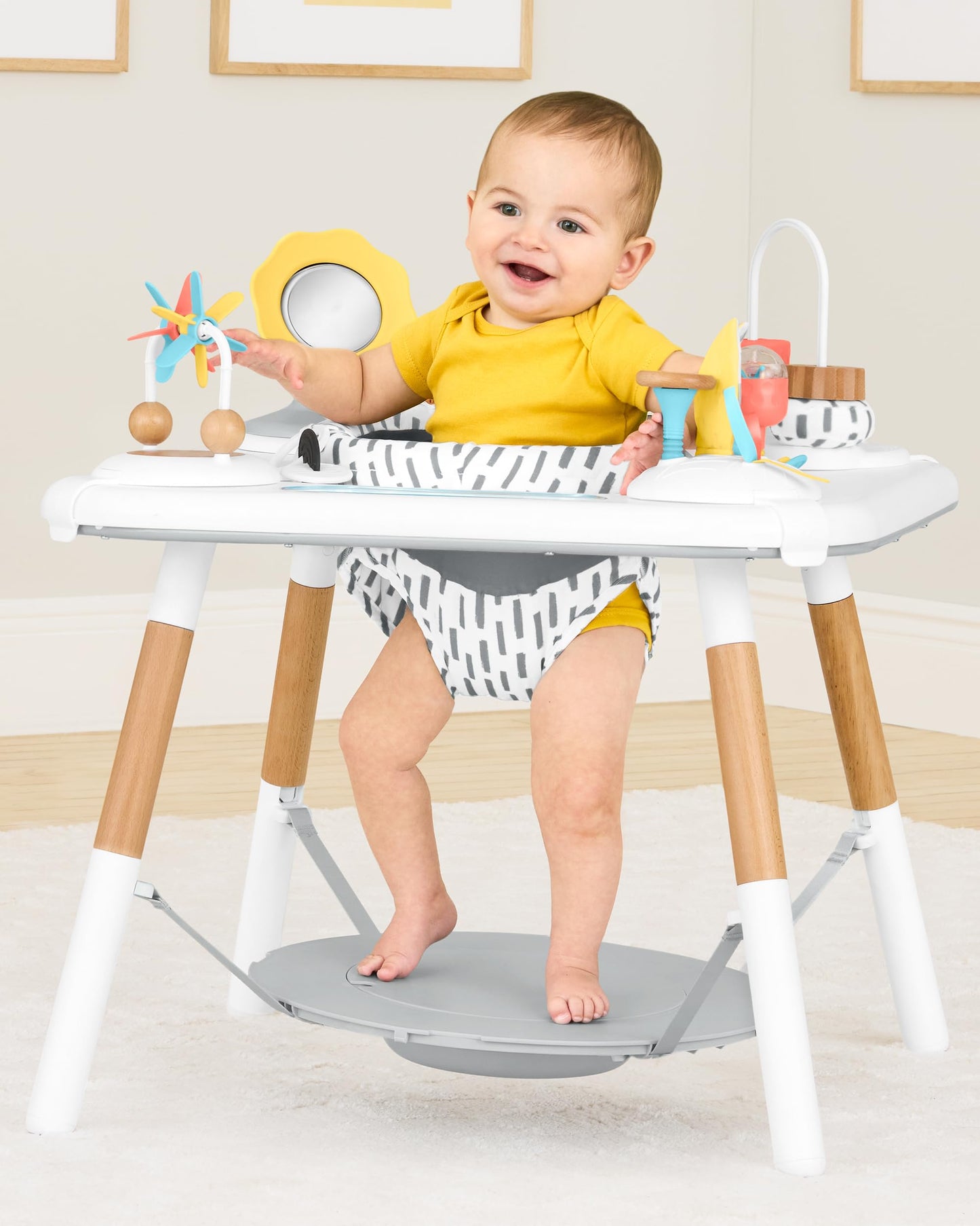 Baby using Skip Hop Discoverosity activity center seated stage