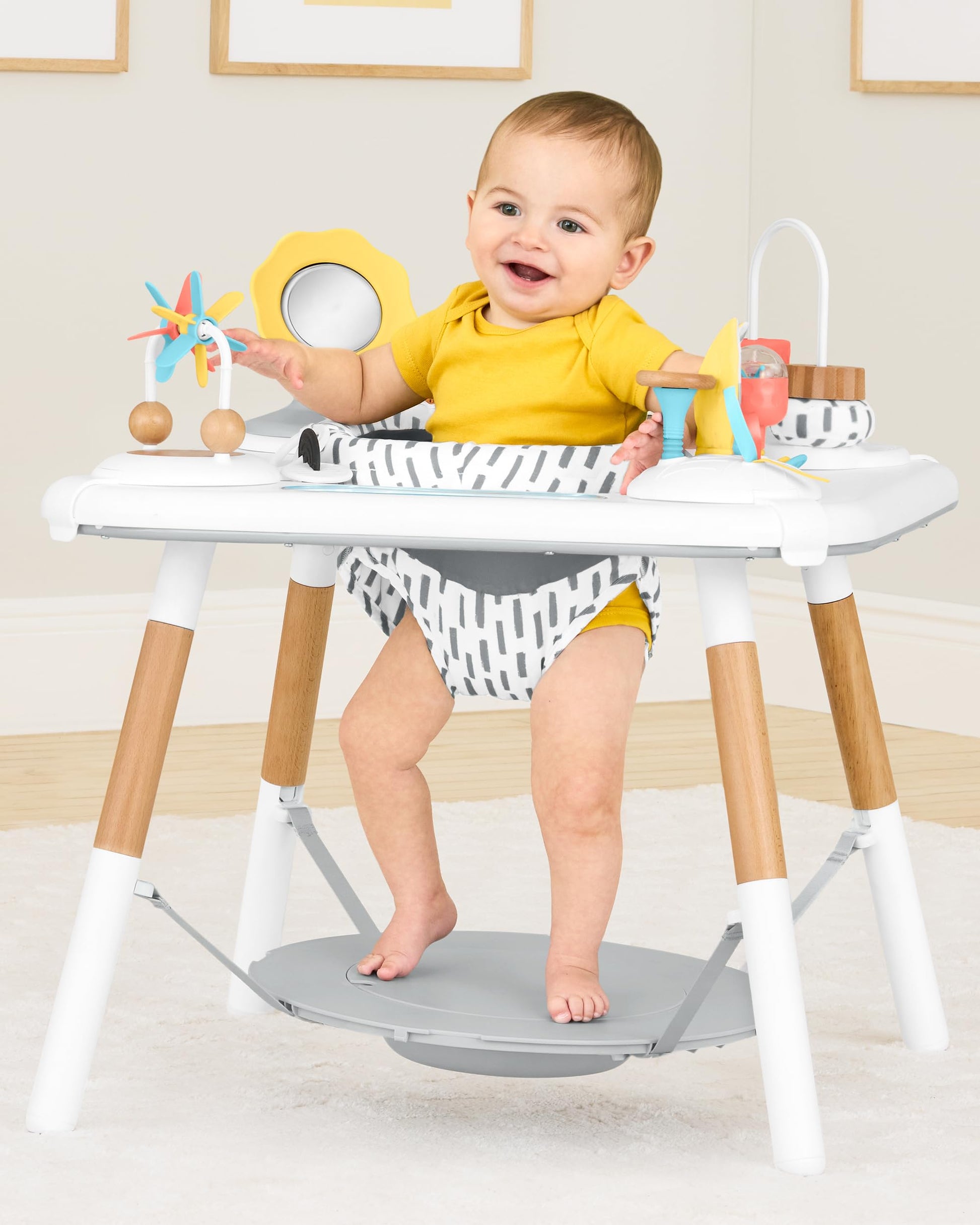 Baby using Skip Hop Discoverosity activity center seated stage