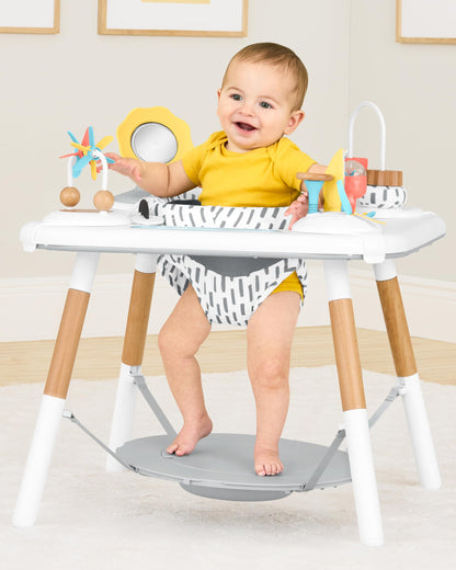 Baby using Skip Hop Discoverosity activity center seated stage