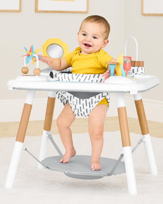 Baby using Skip Hop Discoverosity activity center seated stage
