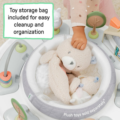 Baby playing in Ingenuity Spring and Sprout activity center