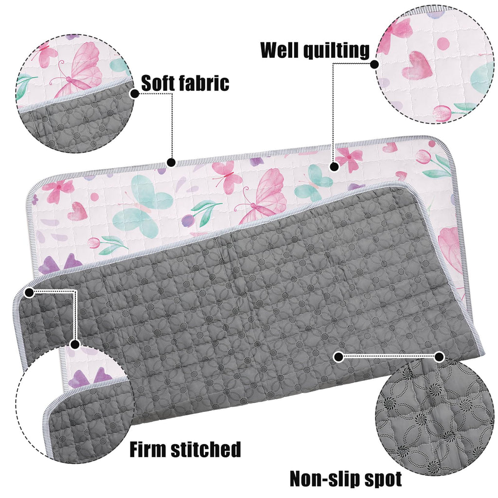 Close-up view of soft microfiber fabric and stitching detail on infant crawling mat.