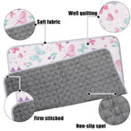 Close-up view of soft microfiber fabric and stitching detail on infant crawling mat.