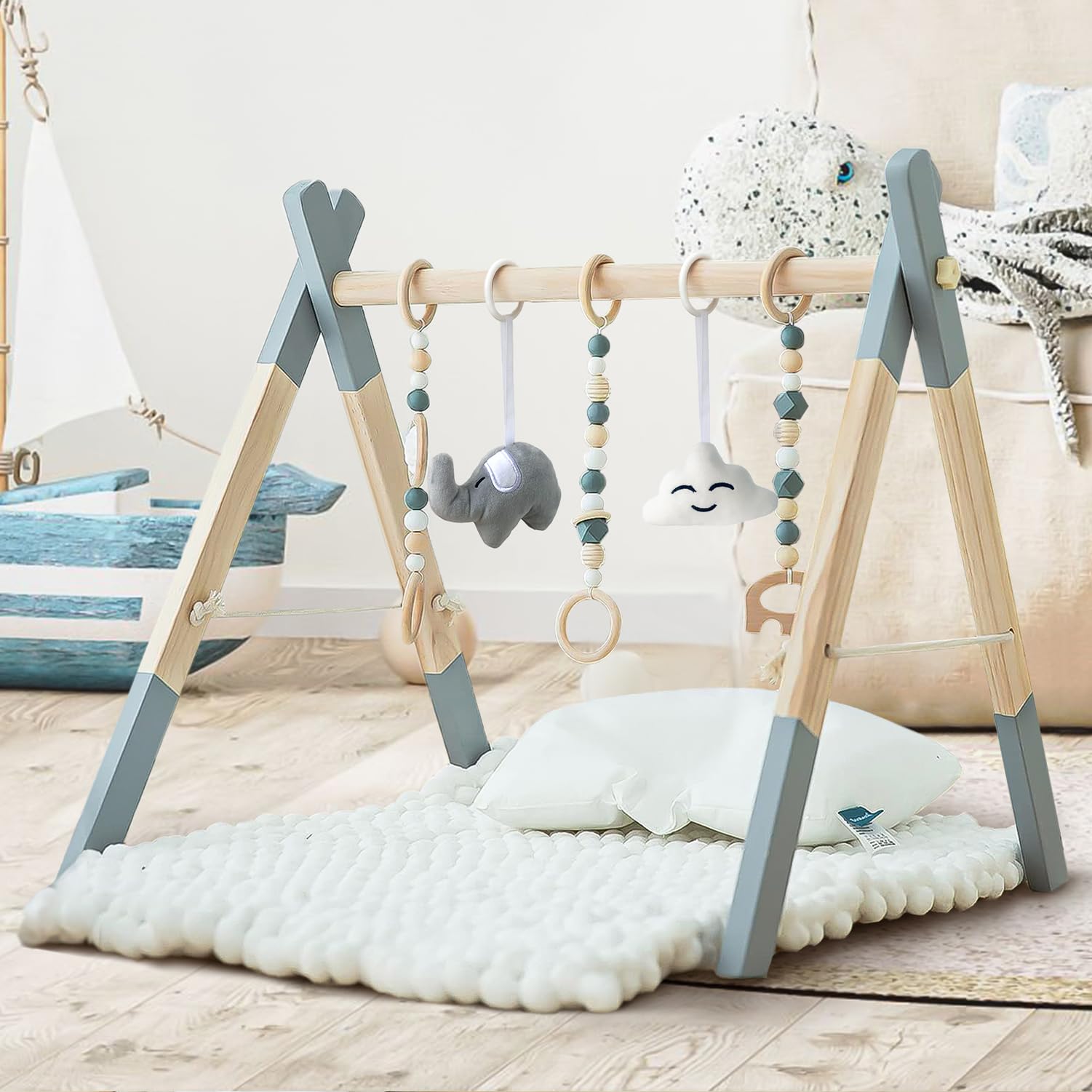 Close up view of the three wooden and two soft sensory hanging toys