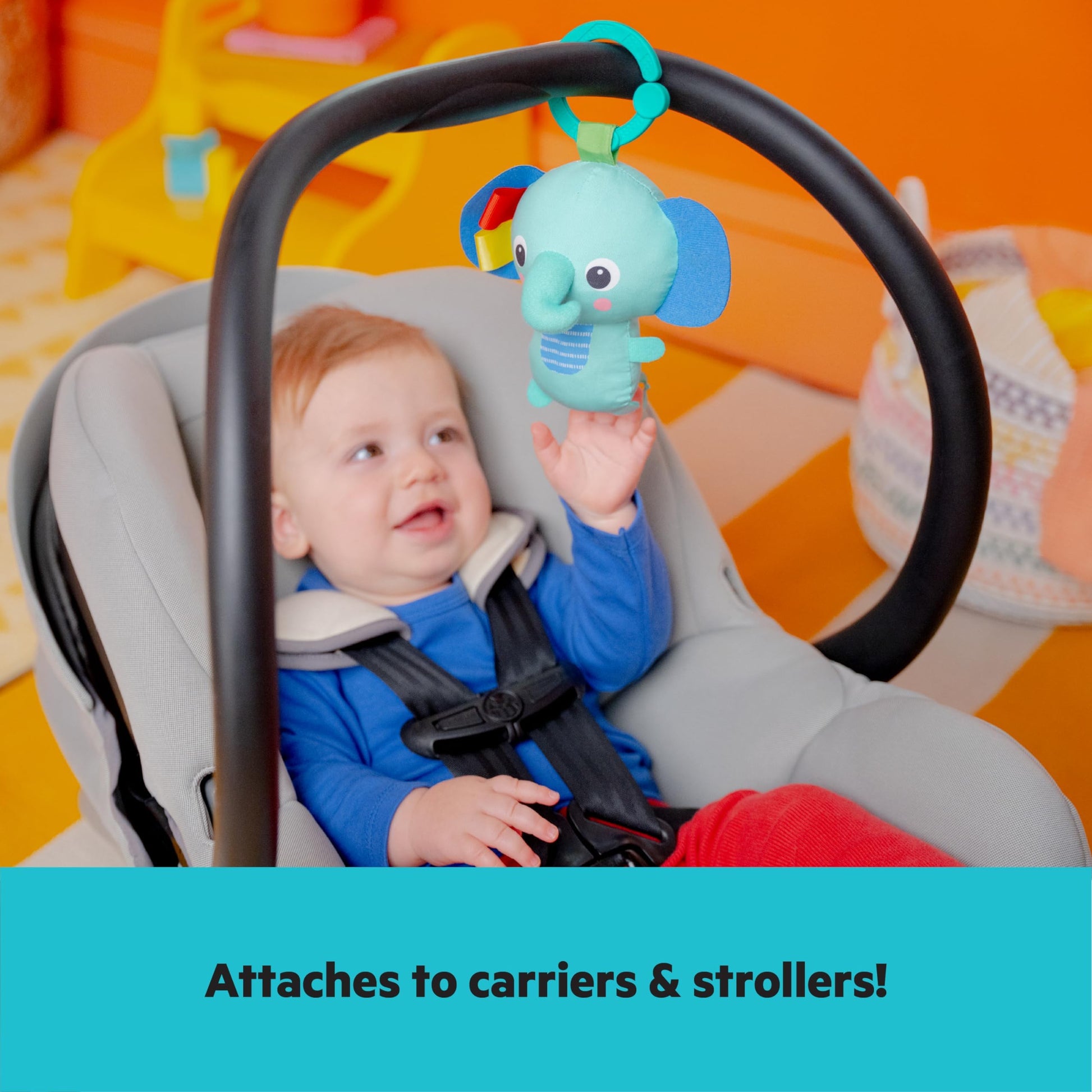 Close up of musical elephant toy on activity gym