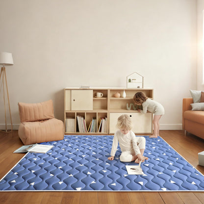 Close-up of the ultra-soft skin-friendly fabric surface on the thick one-piece crawling mat.