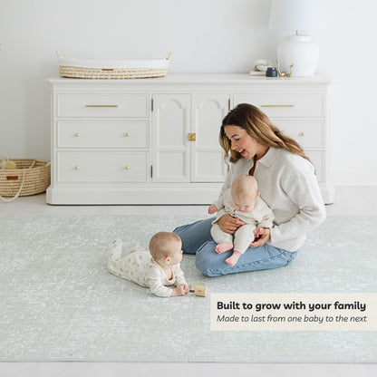 Baby doing tummy time on cushioned Little Landings Eden mat
