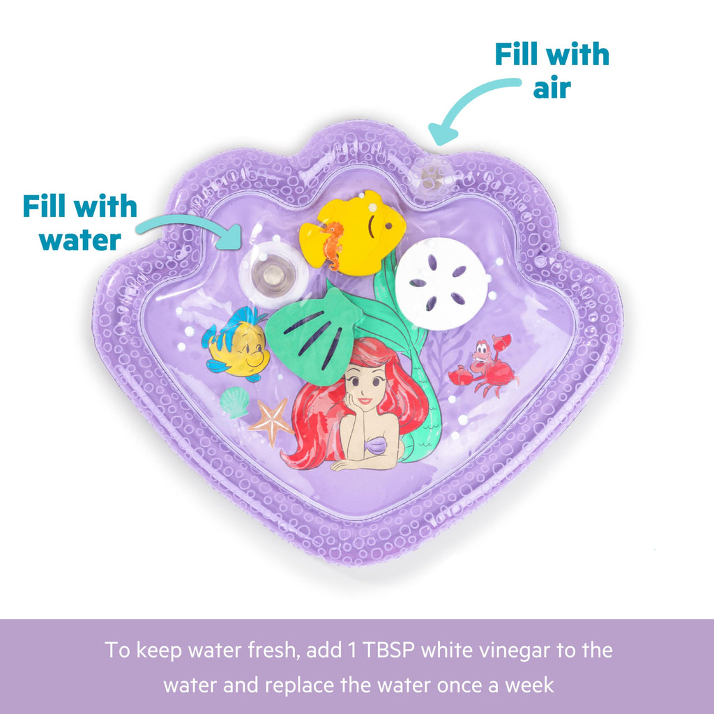 Baby girl enjoying purple Ariel water play mat sensory activity