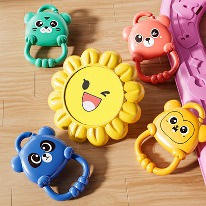 Close up of hanging sensory rattles on baby activity gym