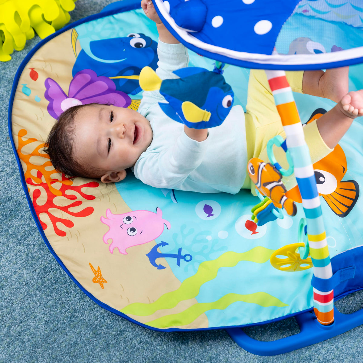 Mr. Ray canopy lights illuminated over the plush play mat