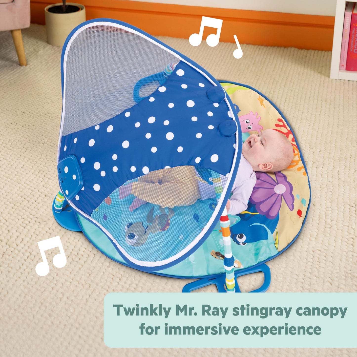 Bright Starts Disney Baby Finding Nemo activity gym folded down demonstrating the machine-washable premium fabric mat.