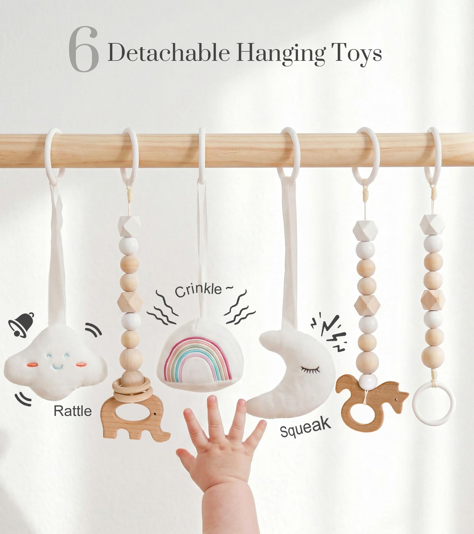 Close up view of the three wooden and three soft plush sensory hanging toys attached to the Mallify play gym frame.