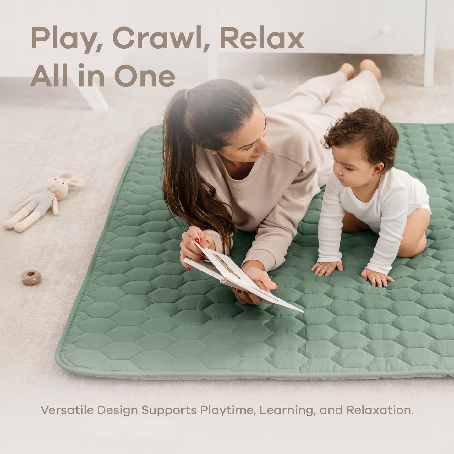 Toddler sitting comfortably on plush Fern green play mat