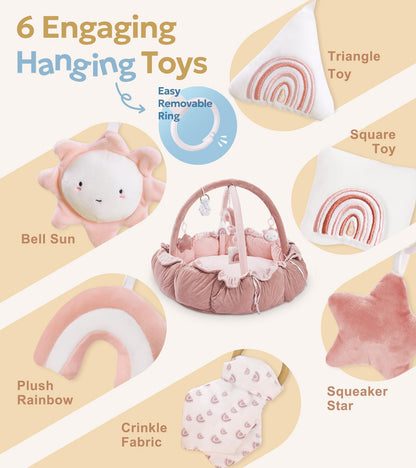 Close up view of the six detachable sensory toys hanging from the pink plush baby gym.