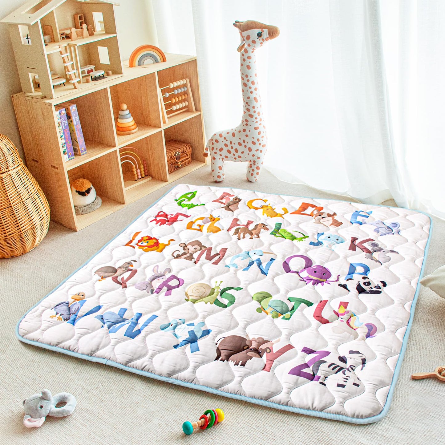 Baby enjoying tummy time on a Beavtaens animal alphabet mat
