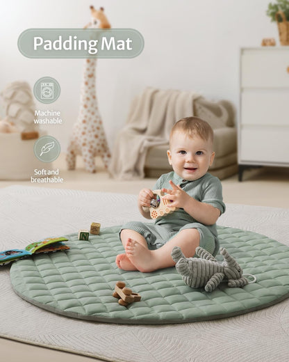 Modern sage green baby play gym in a nursery room setting