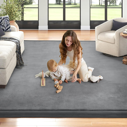 Child playing on ILPEOD memory foam area rug