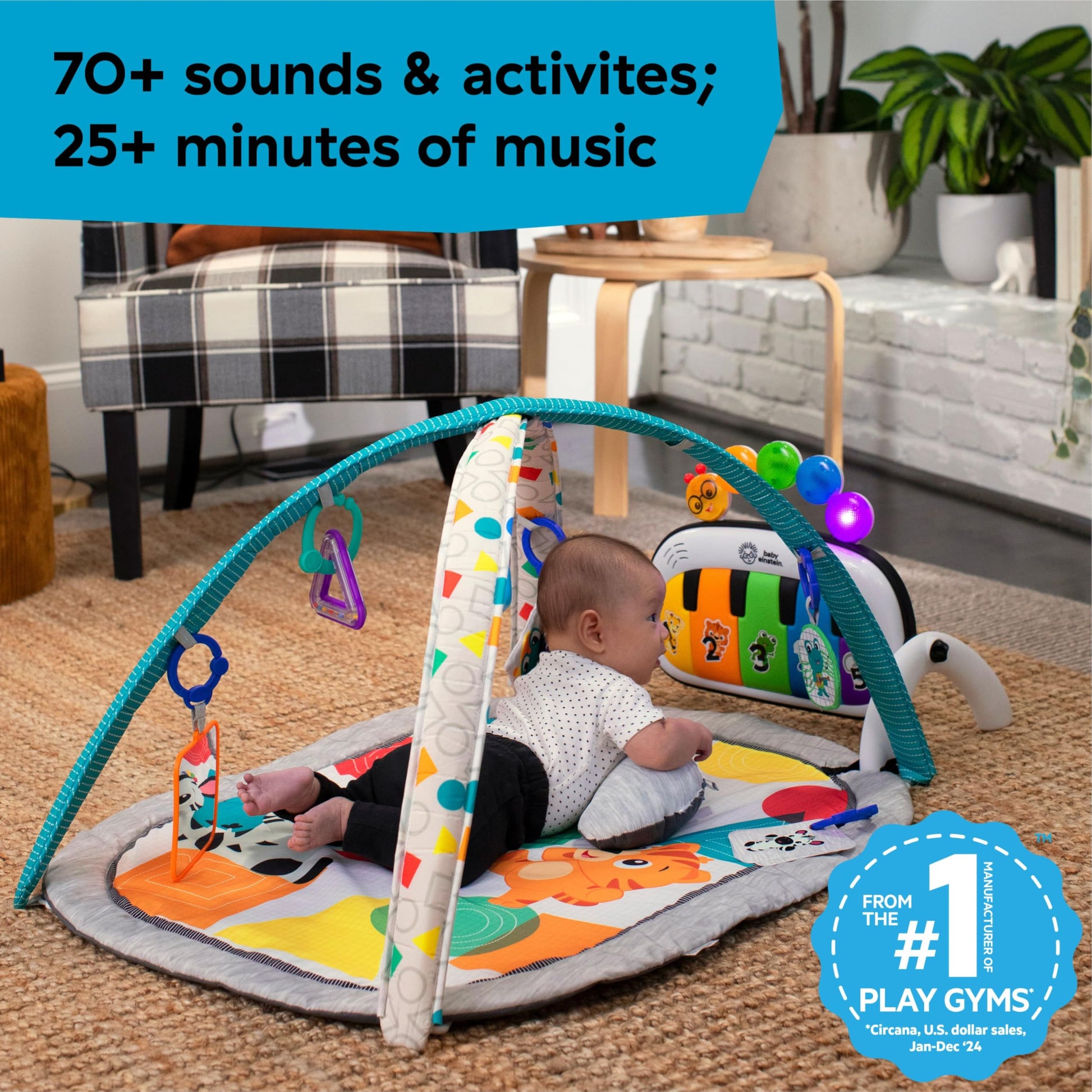 Overhead perspective of the machine washable colorful textile mat with dual toy bar arches.