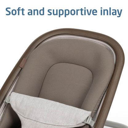 Parent adjusting the Maxi-Cosi Kori bouncer with one hand