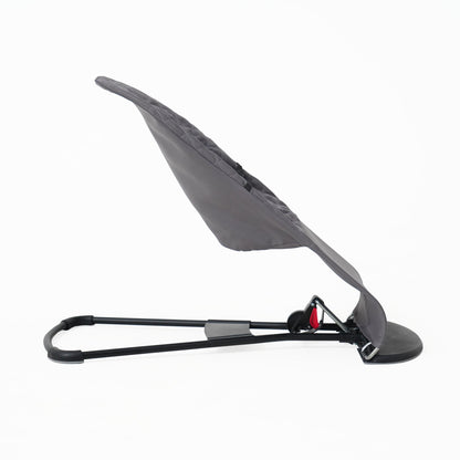 Top down view of breathable grey seat cover for infant bouncer