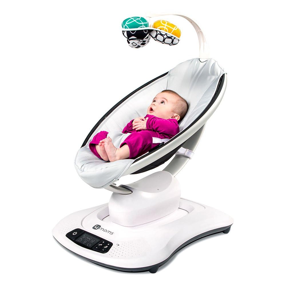 4moms newborn insert installed in a baby swing