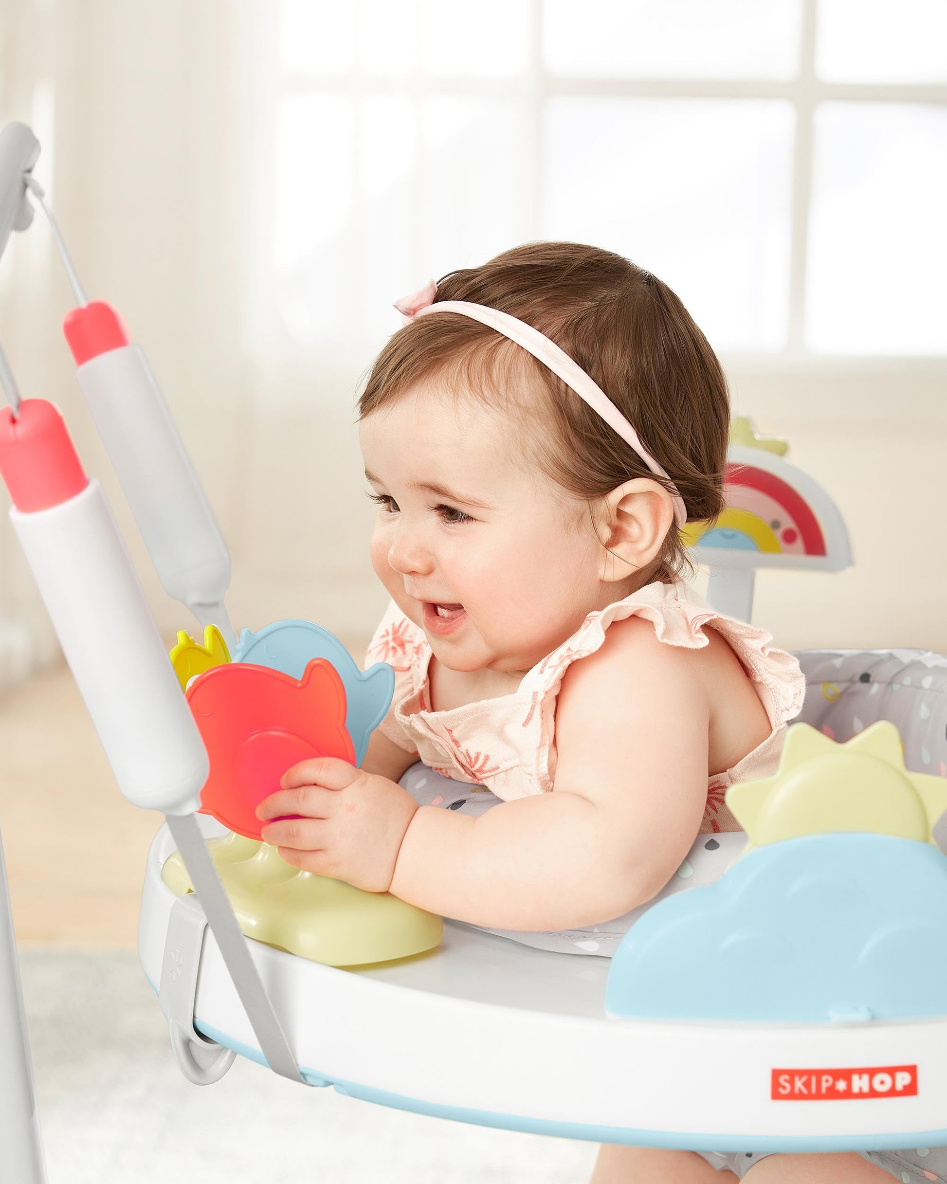 Close up of developmental clip on toys on jumper