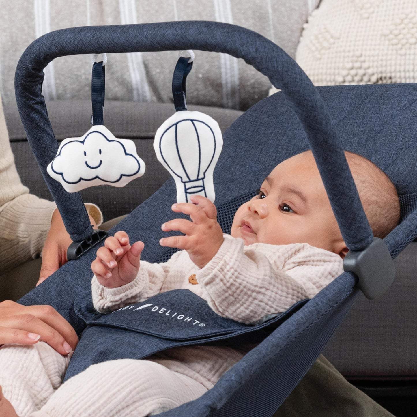 Detail shot of quilted indigo fabric and mesh on Baby Delight bouncer