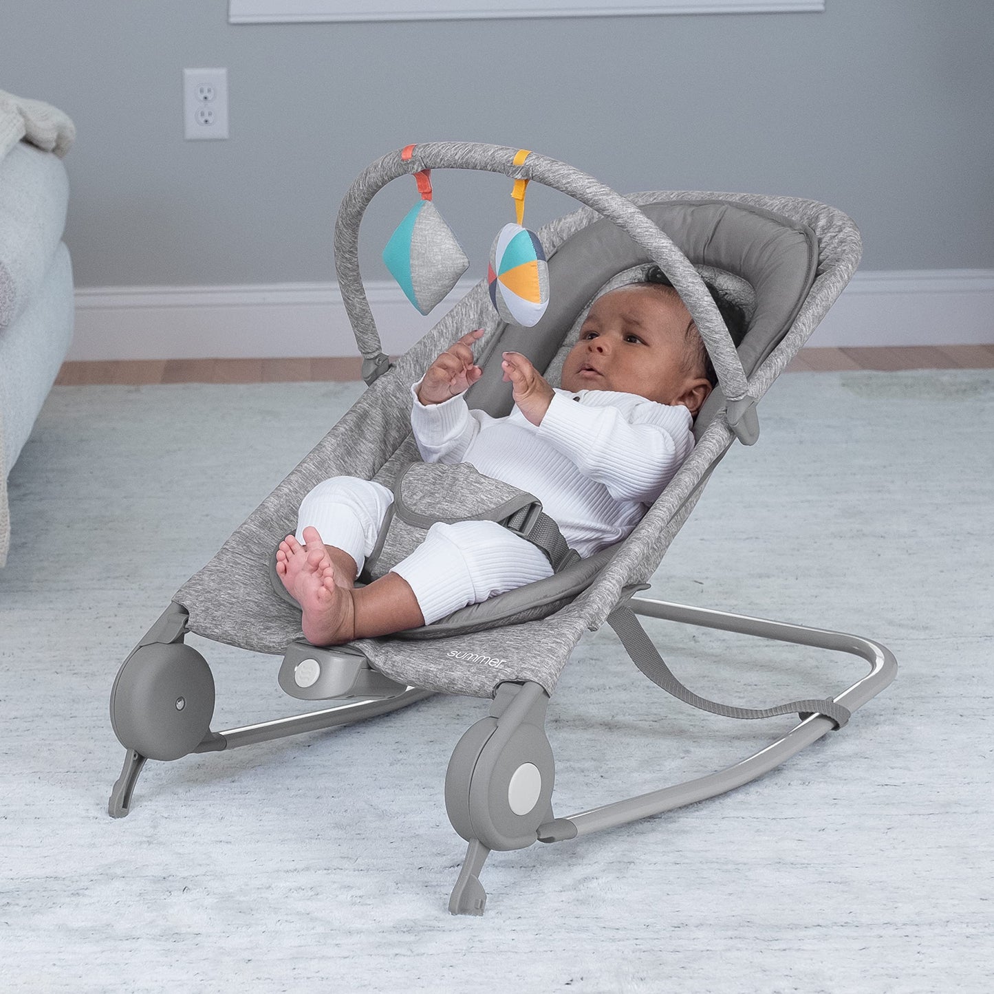 Close up of light gray tweed fabric on Summer Infant bouncer