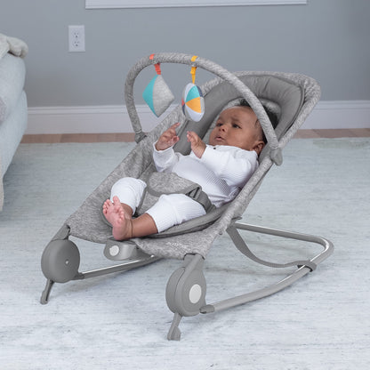 Close up of light gray tweed fabric on Summer Infant bouncer