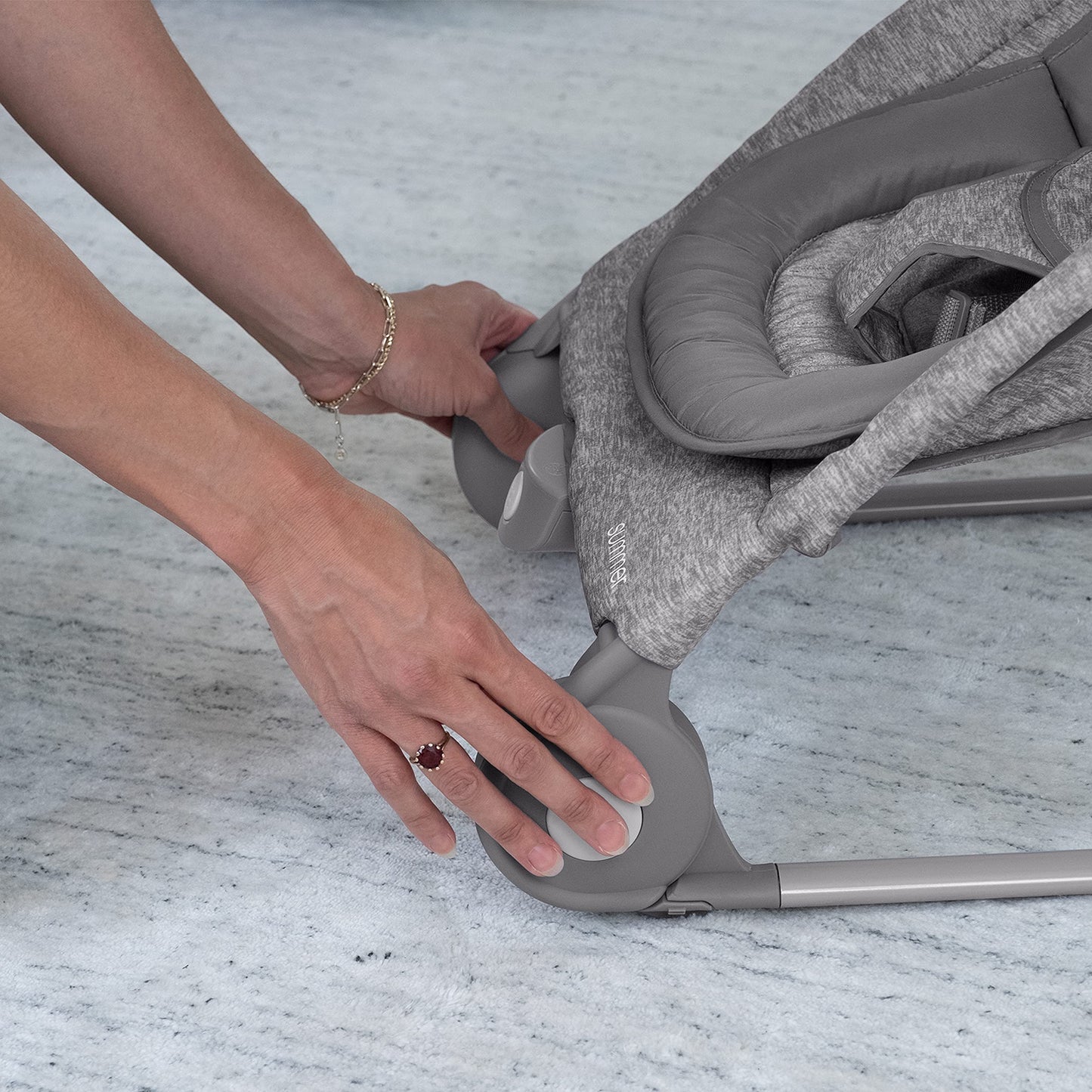 Summer Infant bouncer in bouncing mode with stabilizing feet extended