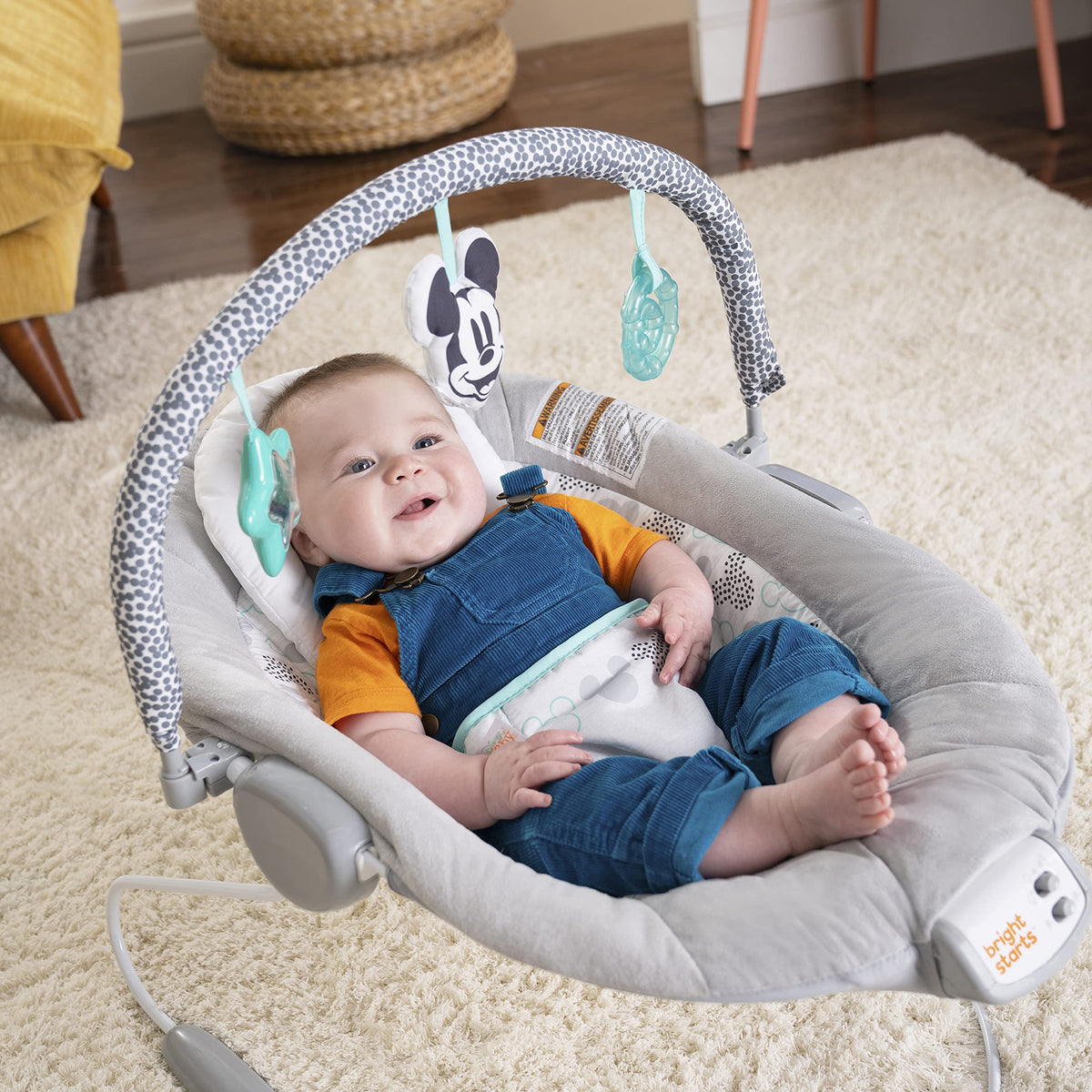 Bright Starts Disney Baby bouncer angled perspective showing character toys
