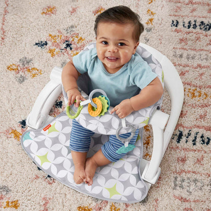 Folded Fisher Price portable baby chair for travel storage
