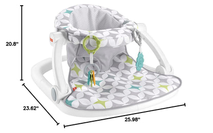 Baby sitting in Fisher Price Portable floor seat at home
