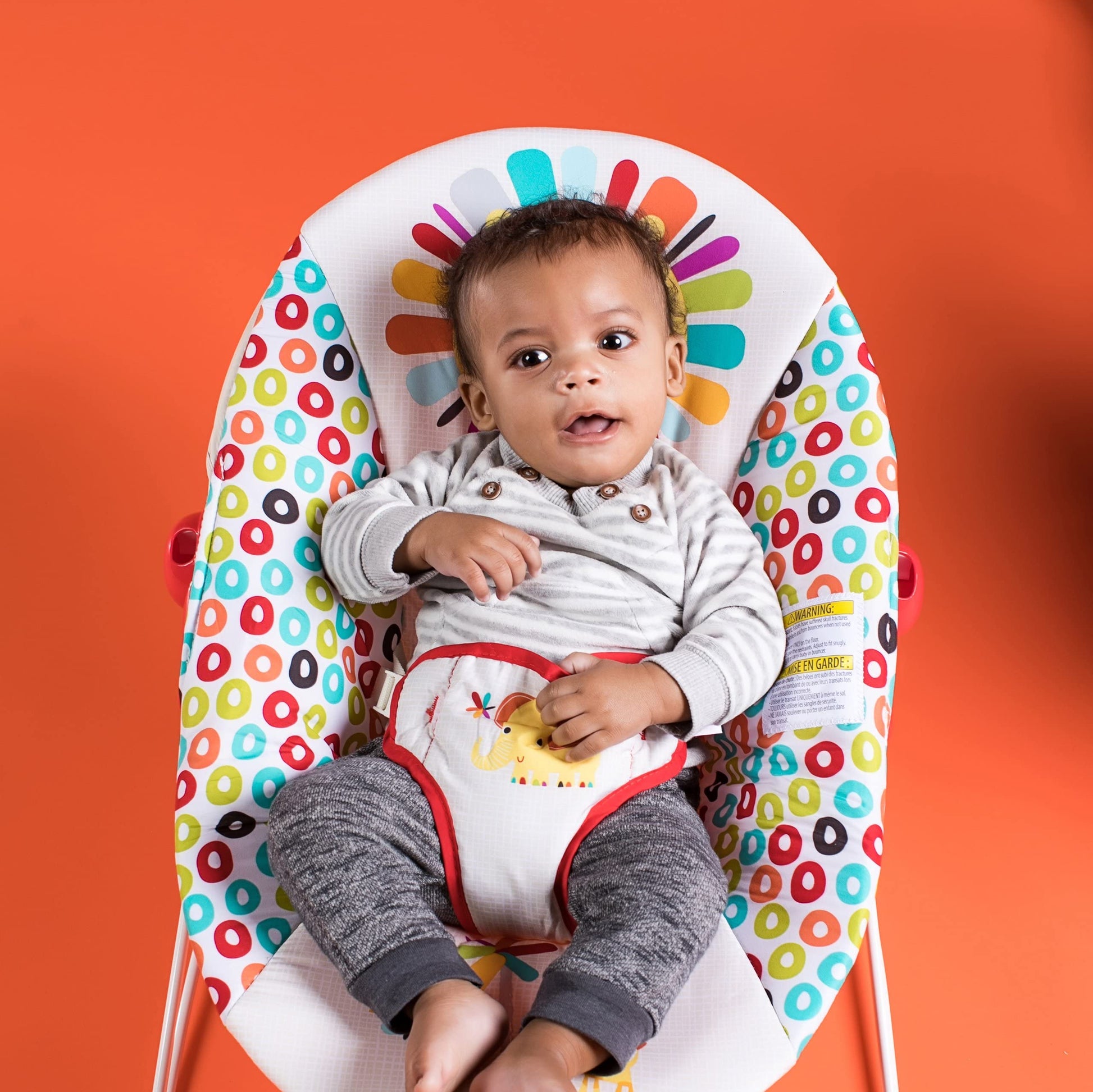 Side profile of Bright Starts bouncer showing the vibration mechanism
