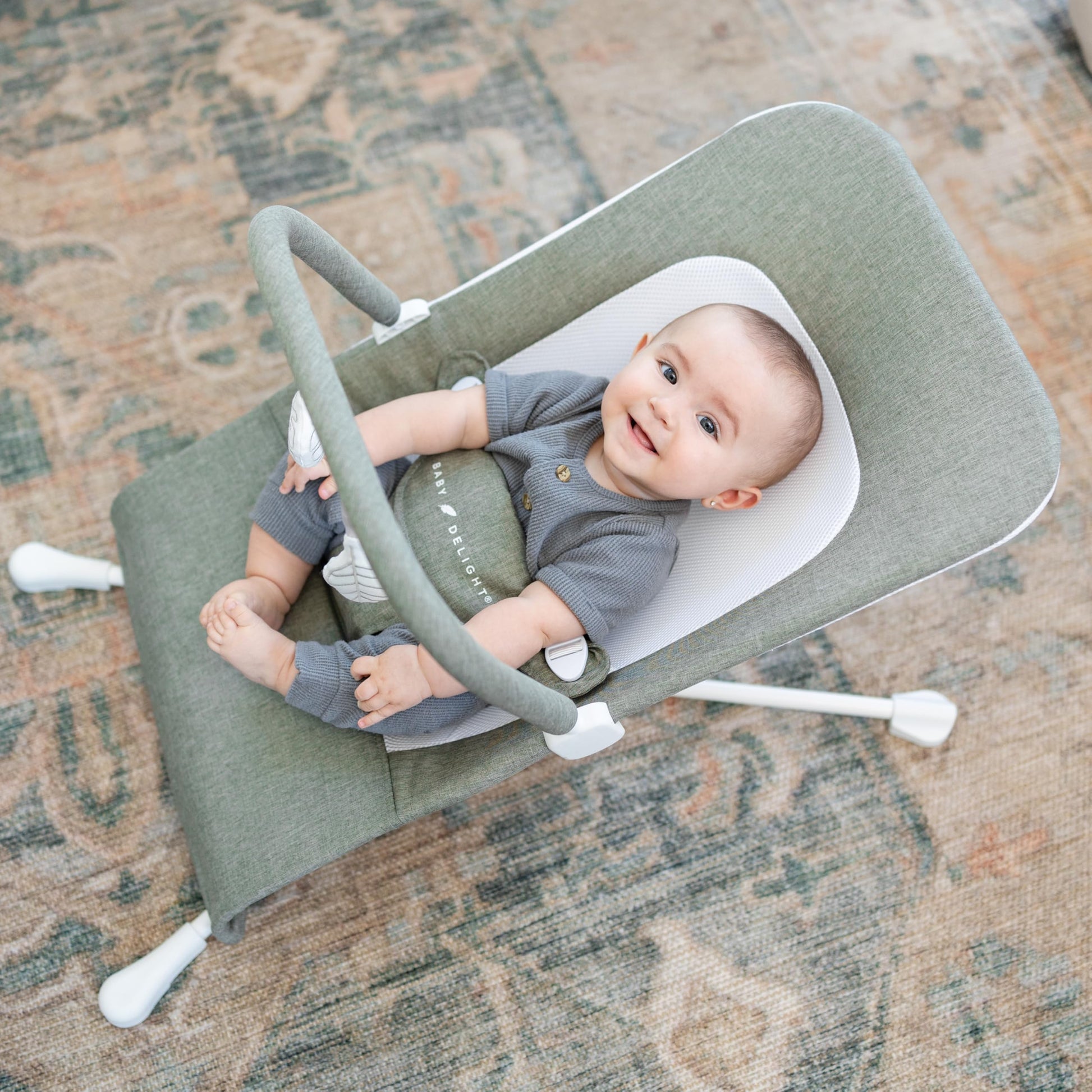Side view of Baby Delight Highland Bouncer showing recline positions