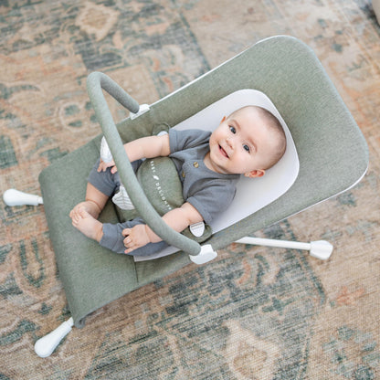 Side view of Baby Delight Highland Bouncer showing recline positions