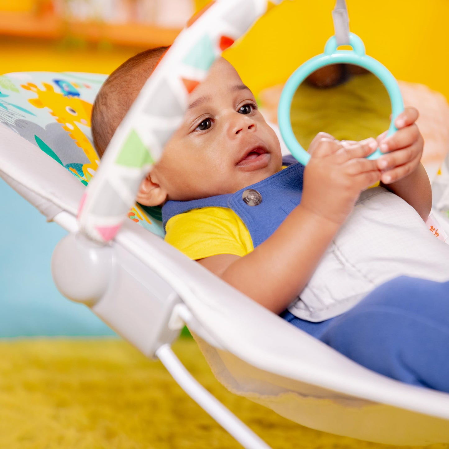 Bright Starts safari fun bouncer on floor setting