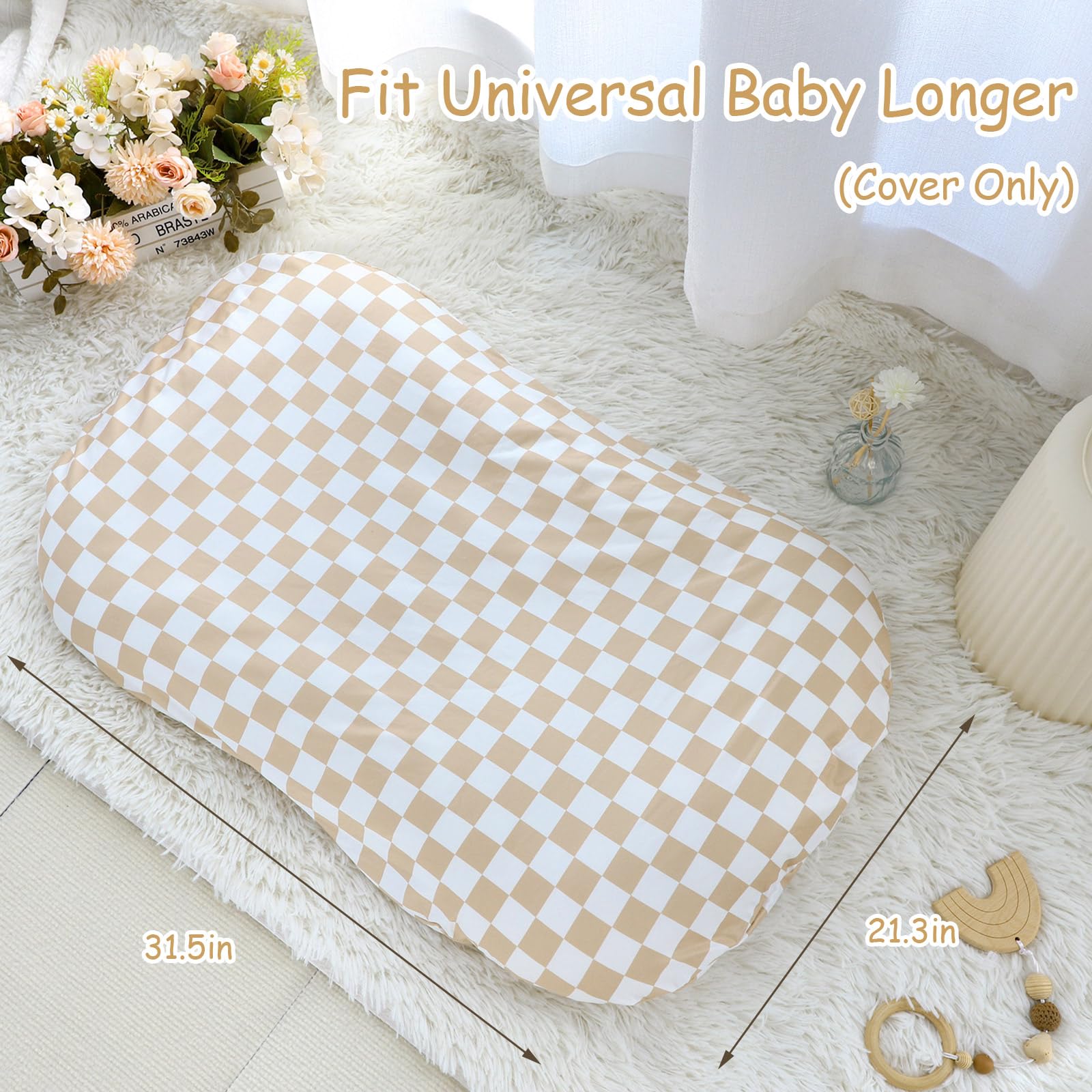Light brown checkerboard baby lounger cover folded on nursery surface