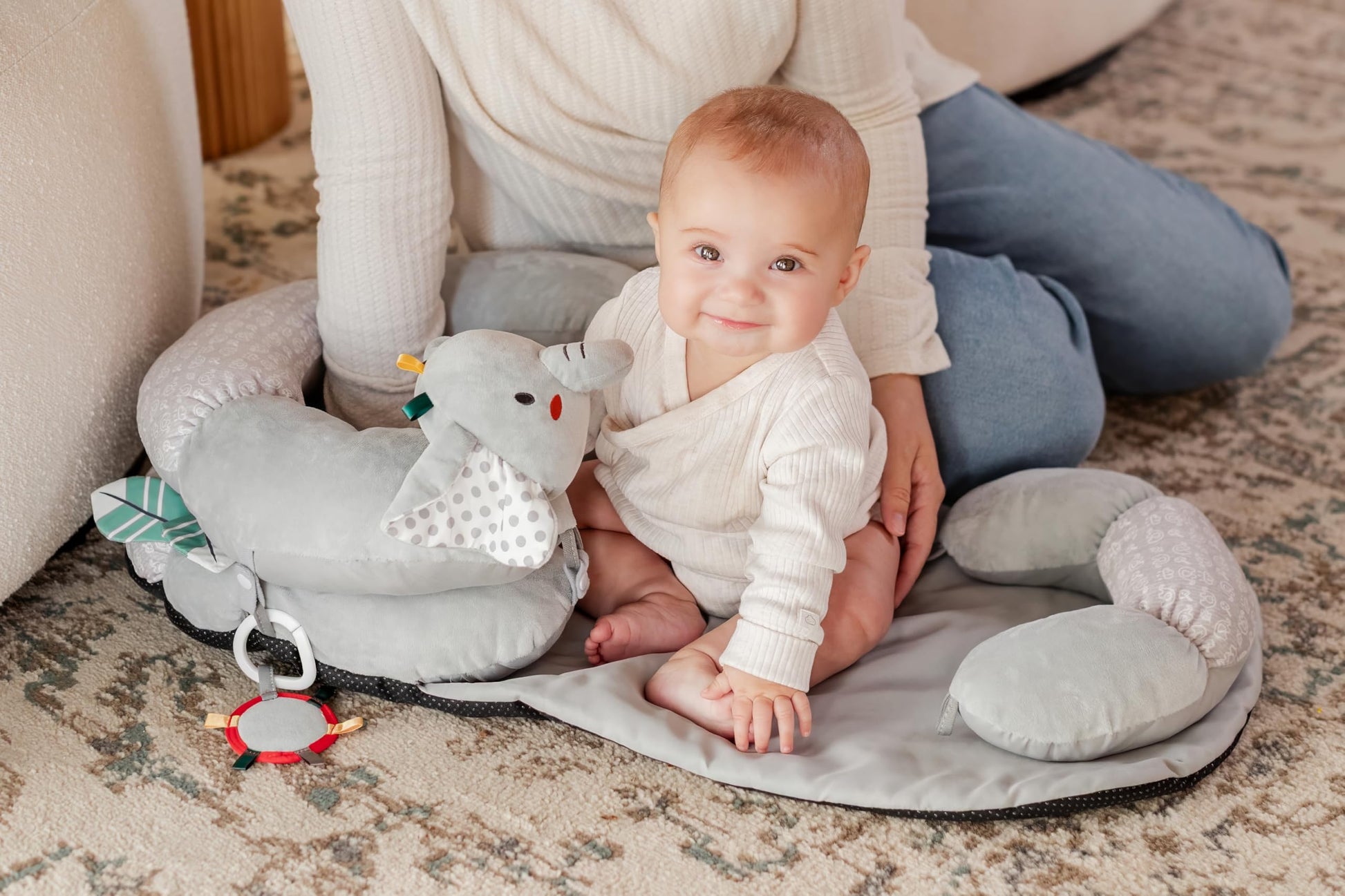 Close up of plush elephant detail on baby floor pillow